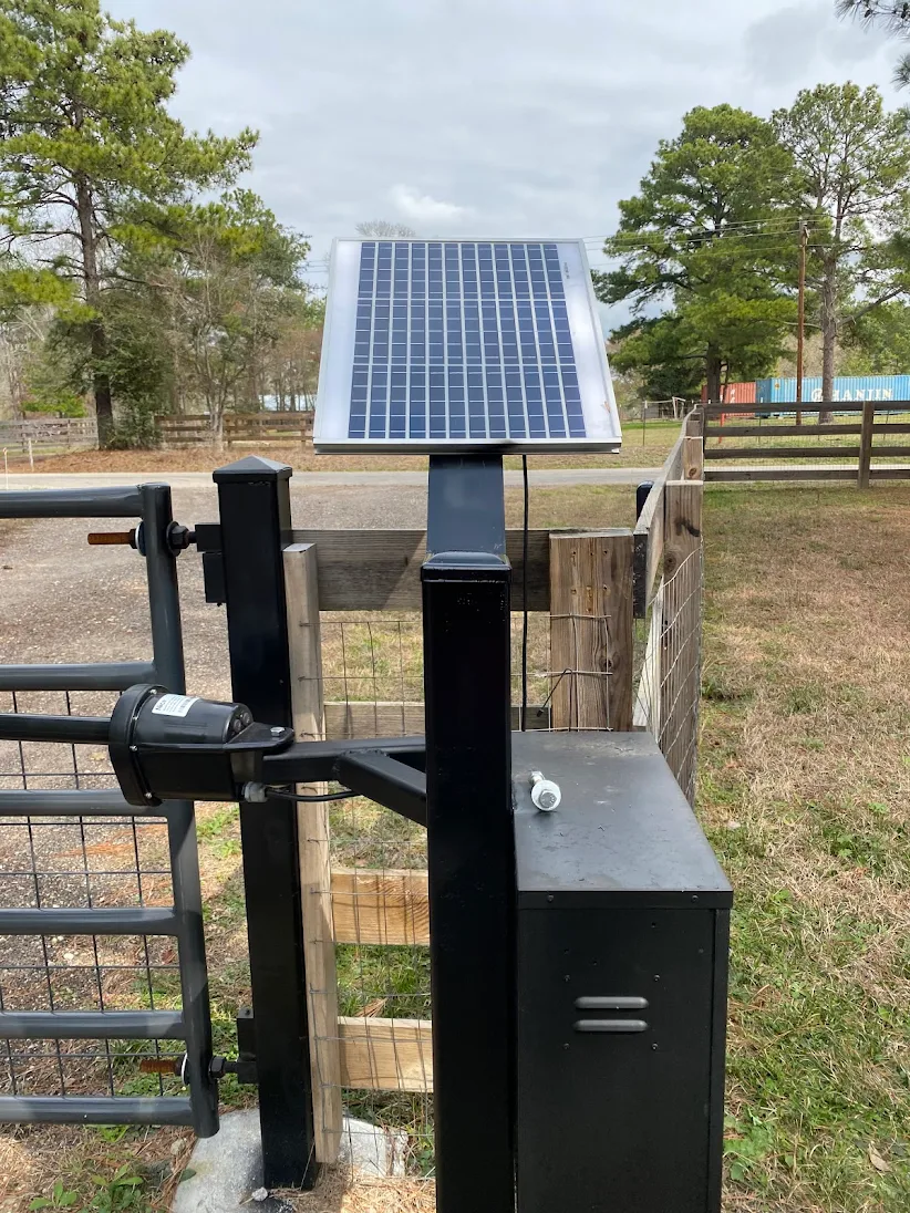Solar panel and battery-backed swing operator on a remote entrance.